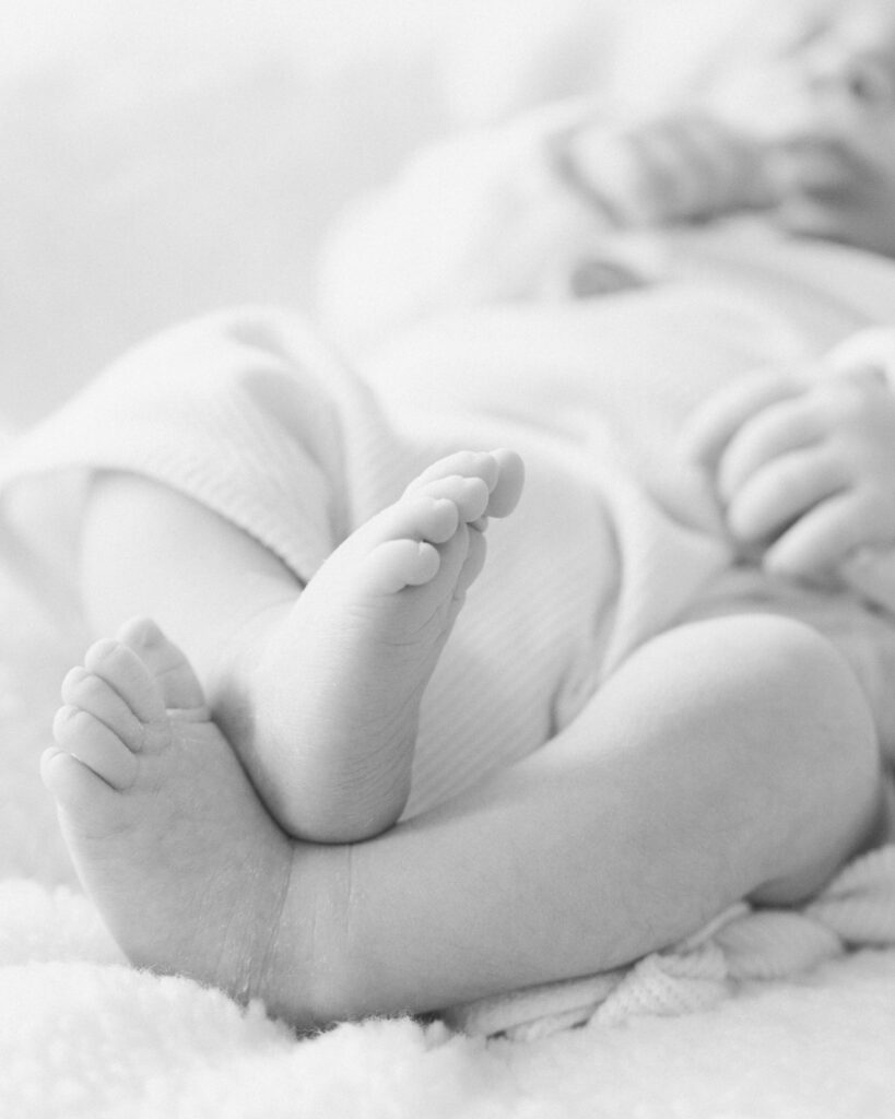 Newborn baby feet photographed during a family session in The Woodlands TX